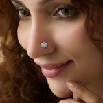 Woman wearing elegant lab grown gold nose pin with sparkling diamond design