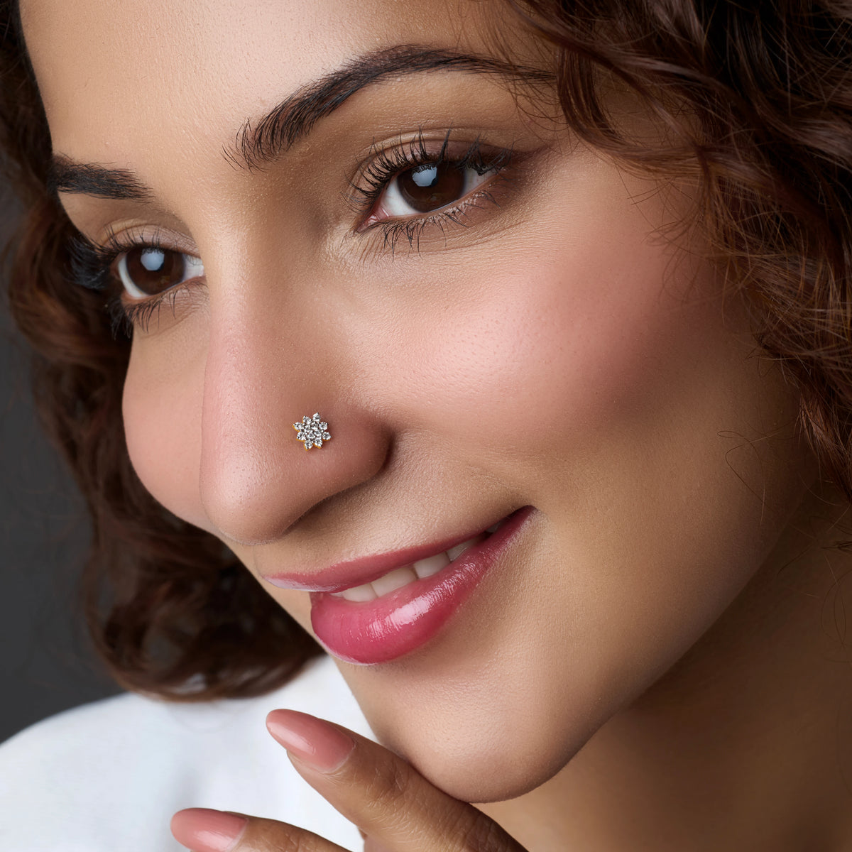 Woman wearing a snowflake-shaped silver nose pin