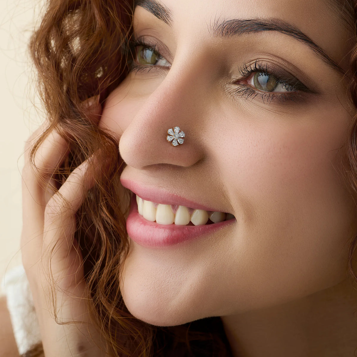 Model showcasing a delicate blooming daisy diamond nose pin