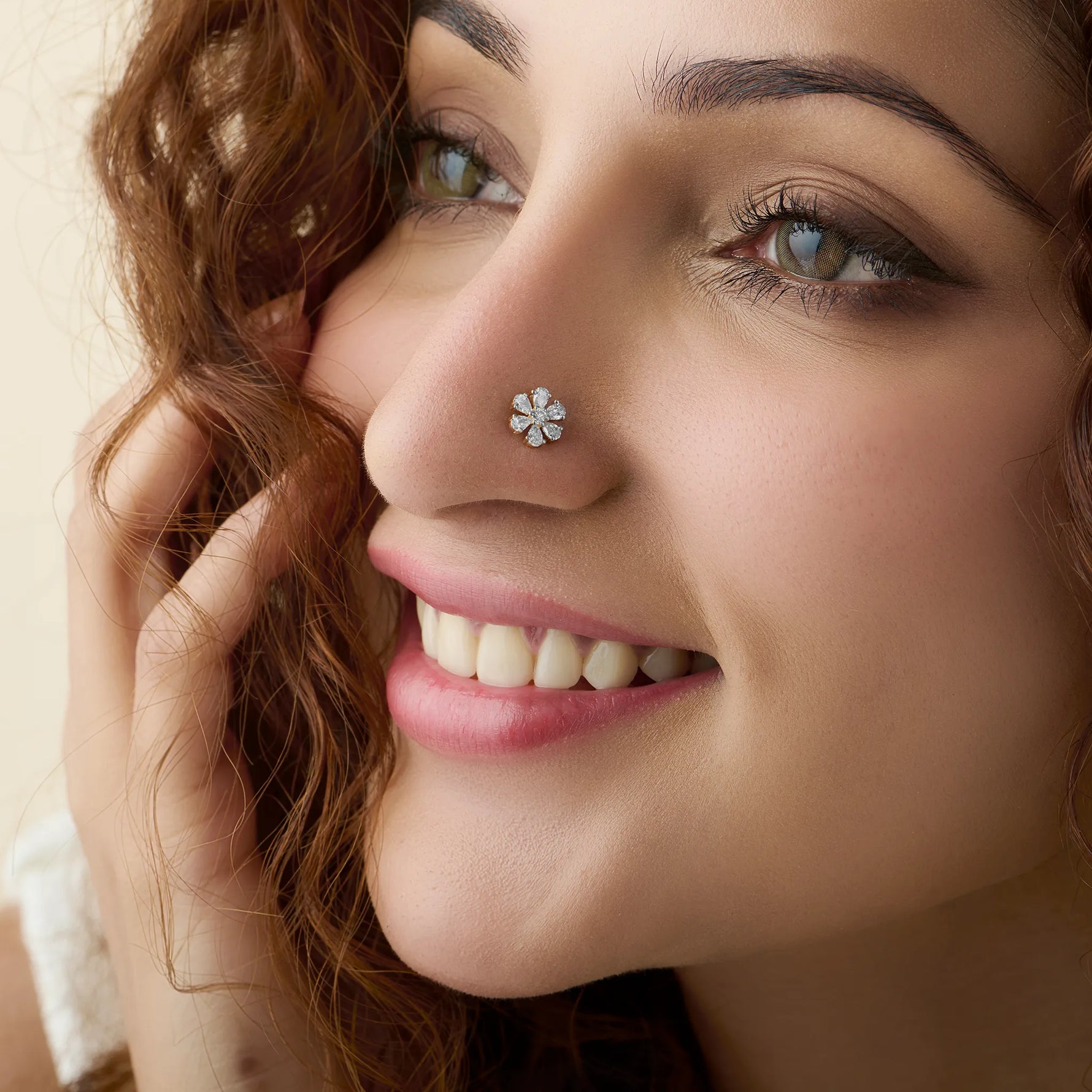 Model showcasing a delicate blooming daisy diamond nose pin