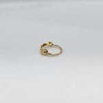 Stars Prism gold nose ring in 18K gold featuring star-shaped design, shown in angled studio view on plain background