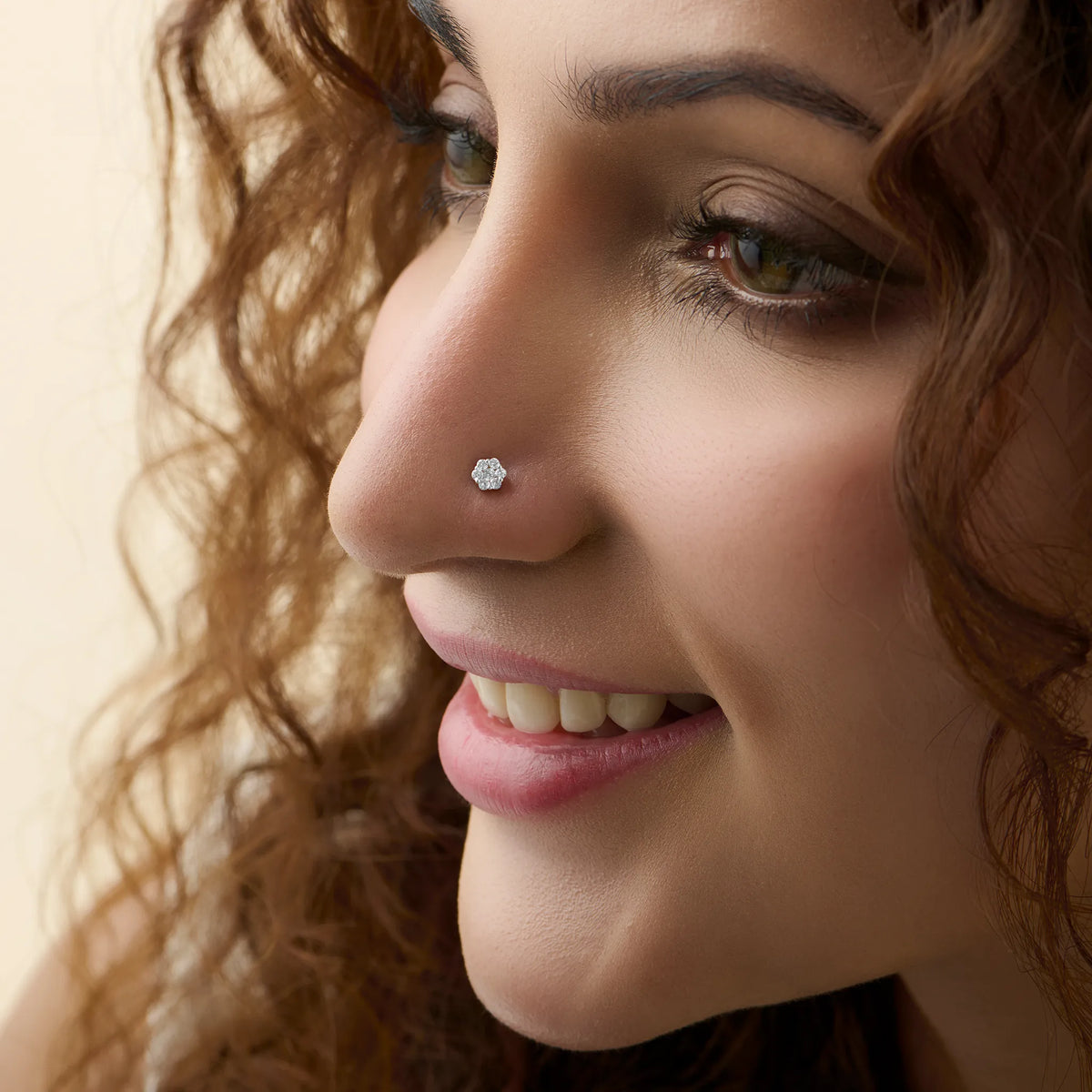 Woman wearing elegant solitaire lab grown diamond nose pin with minimal design