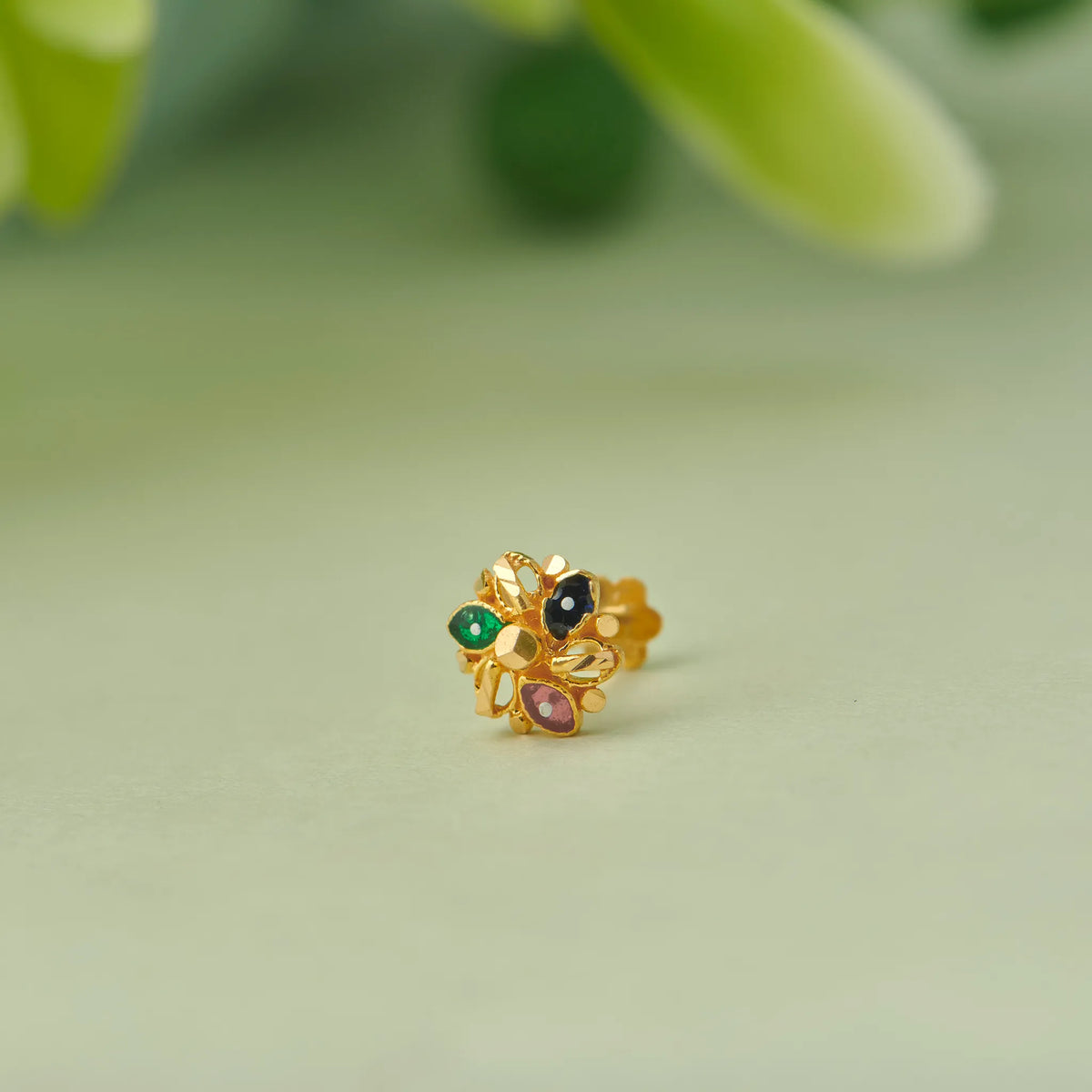 Textured gold earring with multicolor gemstone cluster design