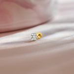 Solitaire lab grown diamond nose pin with round stone on soft pink background