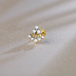 Triangle cluster lab grown gold nose pin with sparkling diamonds on soft background