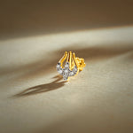 Trending nose pin gold with abstract curved design featuring sparkling stones set in a polished gold base on a soft elegant background
