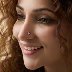 Woman wearing lab grown diamond nose pin with elegant minimal diamond style